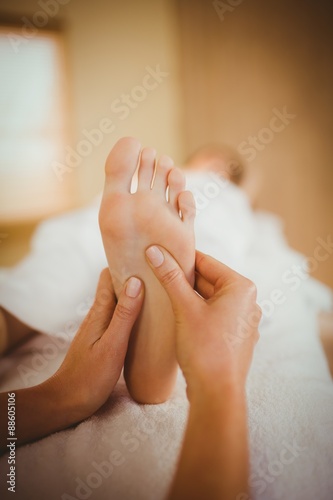 Young woman getting foot massage