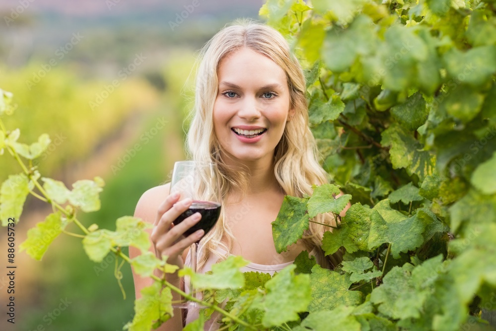 Young happy woman holding a glass of wine Young happy woman holding a glass of wine