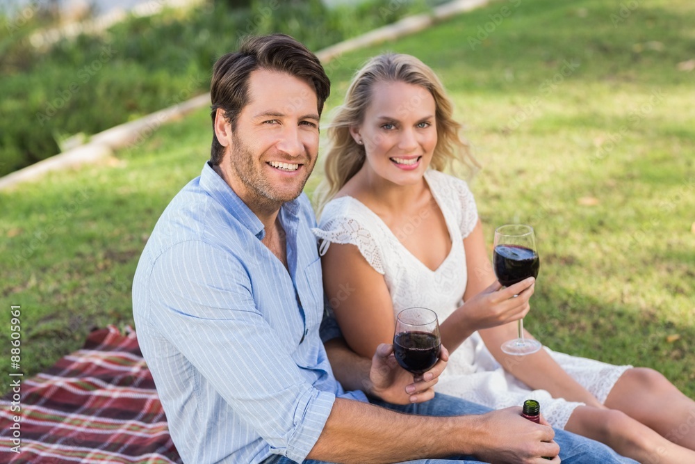 Cute couple on date holding red wine glasses Cute couple on date holding red wine glasses