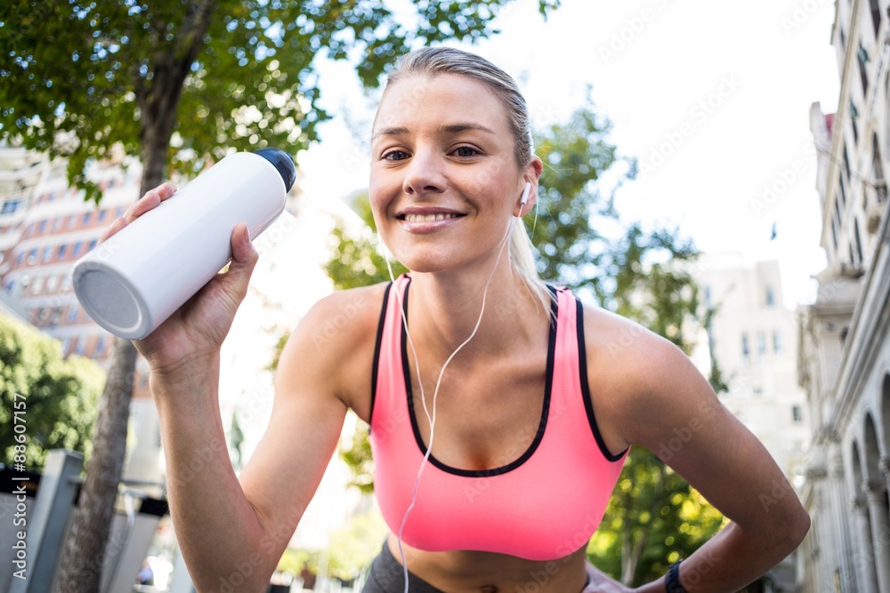 A beautiful woman holding a bottle of water A beautiful woman holding a bottle of water
