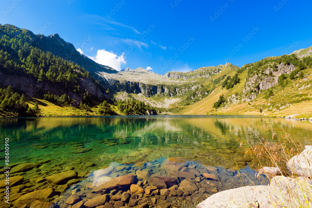 Fototapeta premium Lago di Campo - Adamello Trento Italy. Lago di Campo (Campo lake) 1944 m. Small beautiful alpine lake in the National Park of Adamello Brenta, Trentino Alto Adige, Italy