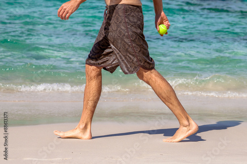 Man walking on beach photo