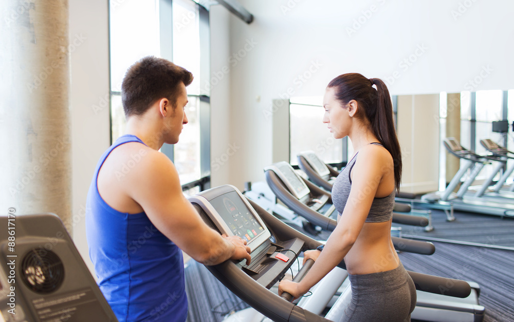 woman with trainer on treadmill in gym woman with trainer on treadmill in gym