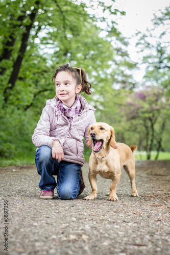 Photo of little girl with a dog