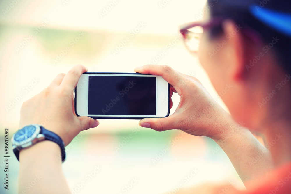 closeup of young woman hands use smart phone in city closeup of young woman hands use smart phone in city
