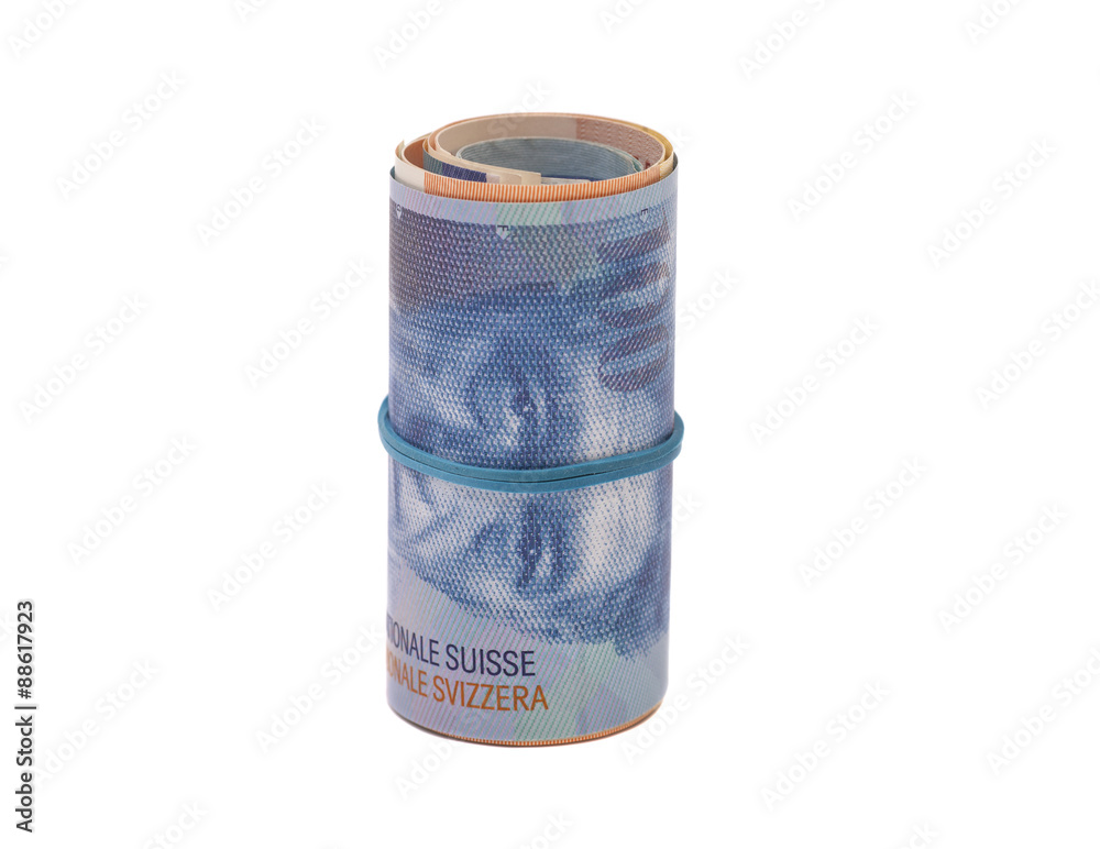 Swiss francs in a roll on white background Swiss francs in a roll on white background