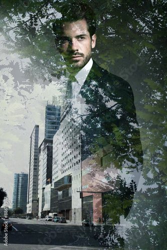 Double exposure of young confident businessman. photo