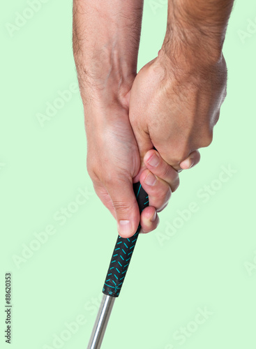 Man showing a two-handed golf club grip
