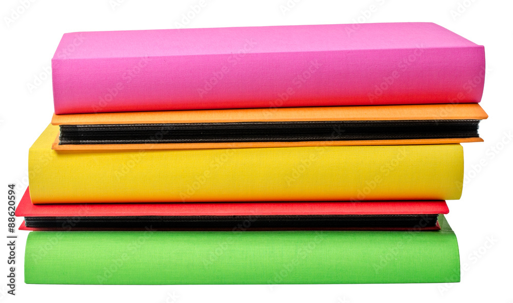 The pile of colored photo albums on wite backround The pile of colored photo albums on wite backround