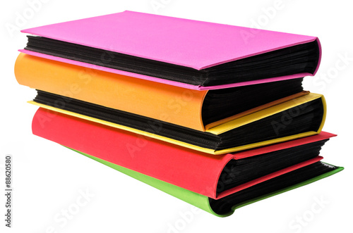The pile of colored photo albums on wite backround
