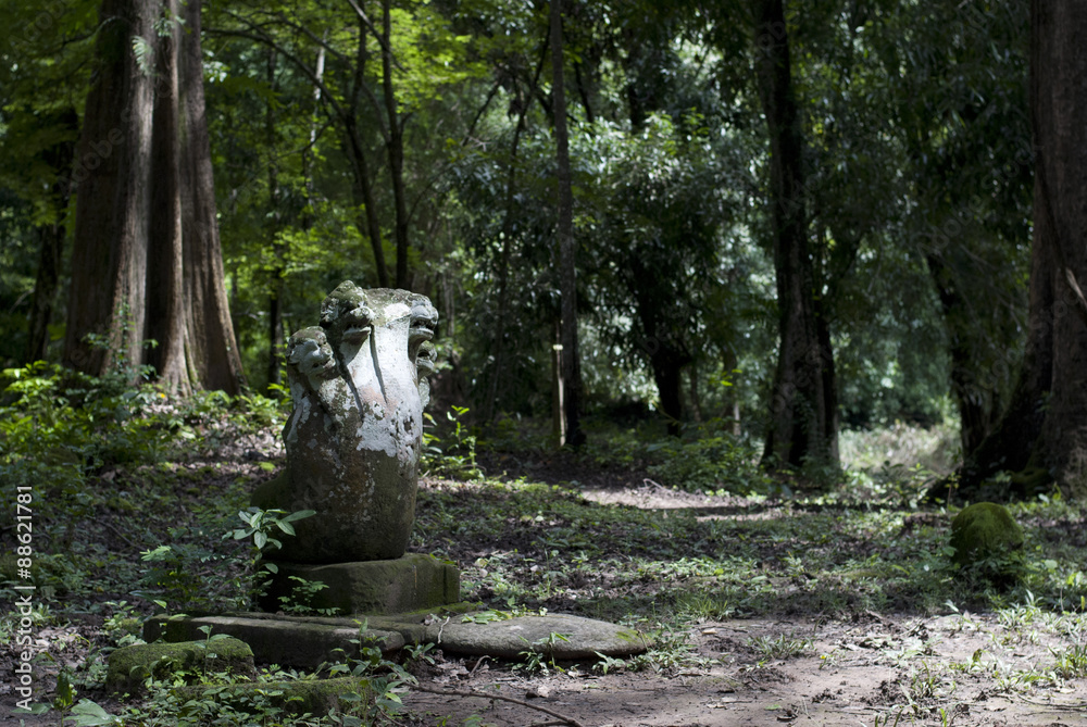 Five-headed Naga Statues in an Angkorian ruins area in Laos Five-headed Naga Statues in an Angkorian ruins area in Laos