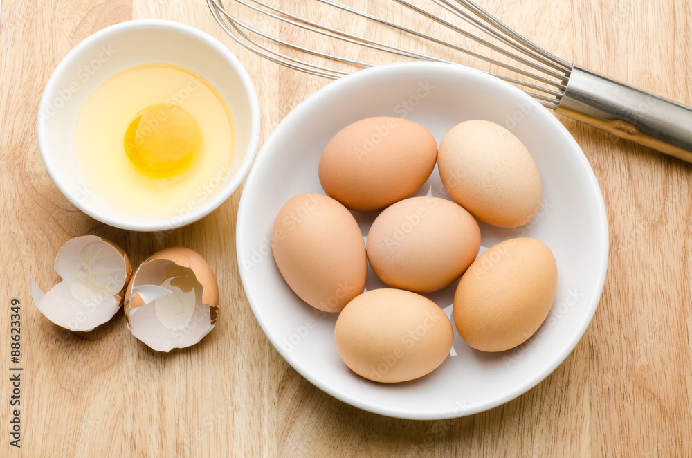 Fresh eggs in the bowl on wooden background prepare for cooking Fresh eggs in the bowl on wooden background prepare for cooking