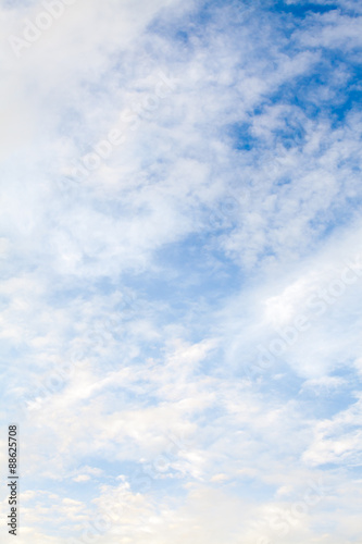 Blue sky with clouds and sun. Background