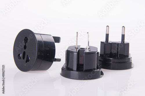 Travel plug adapter on a background