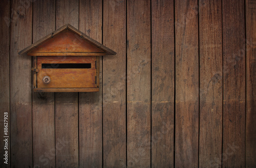 A mailbox on an old wooden wall, Old wooden mailbox, vintage style.