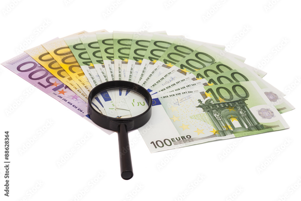 Euro banknote under magnifying glass Euro banknote under magnifying glass