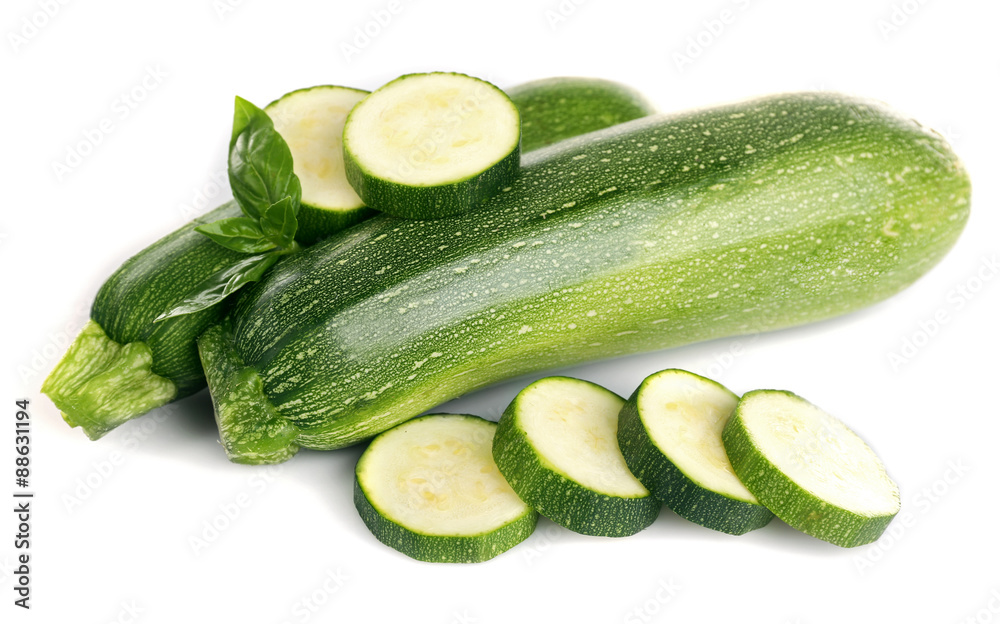 Fresh zucchini with basil isolated on white Fresh zucchini with basil isolated on white
