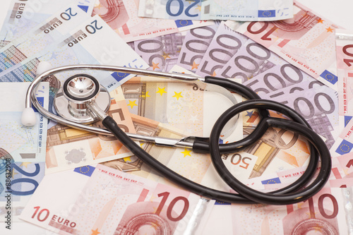Euro banknotes and stethoscope