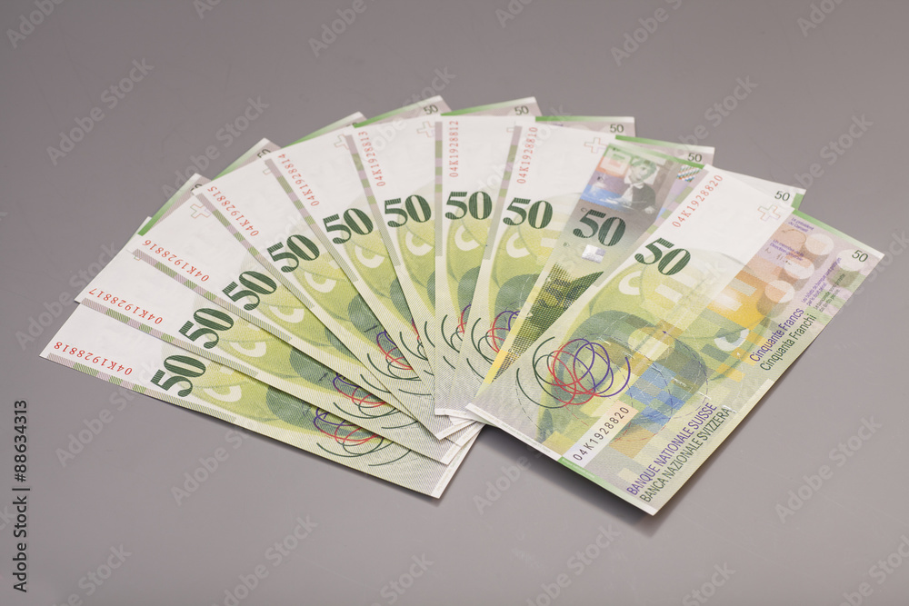 50 Swiss Franc bills isolated on gray background 50 Swiss Franc bills isolated on gray background