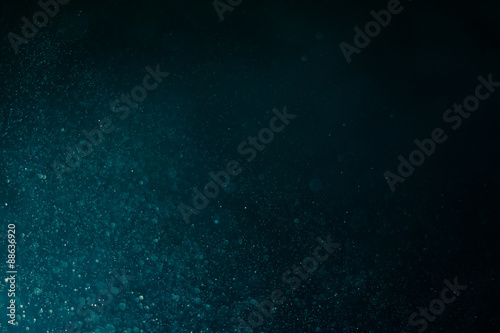 abstract dark bokeh lights background , defocused background, glowing galaxy