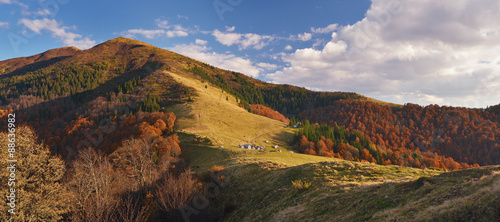Autumn landscape with wooden houses in the mountains #88636982