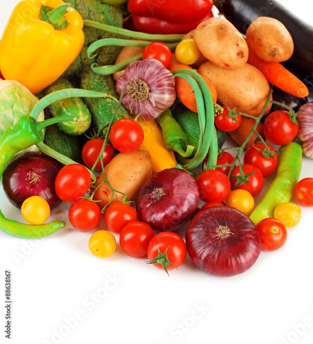 Heap of fresh vegetables isolated on white