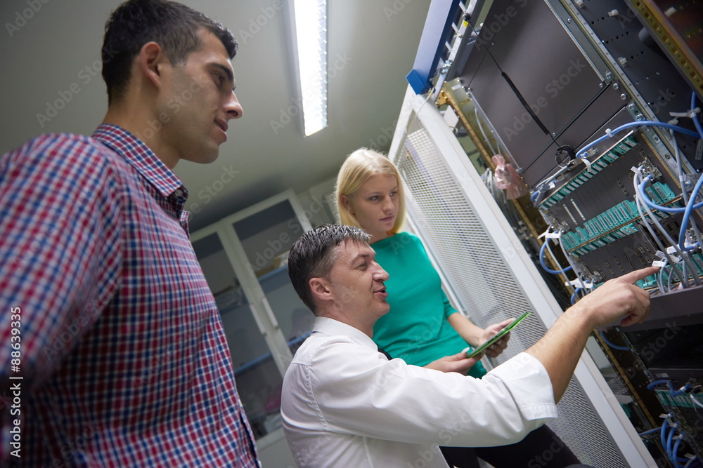 network engeneers working in network server room network engeneers working in network server room