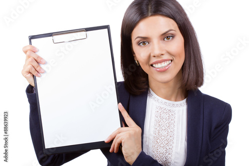Portrait of young business woman with clipboard