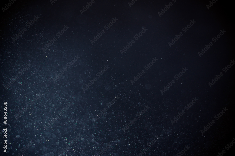 Fototapeta premium abstract dark bokeh lights background , defocused background, glowing galaxy