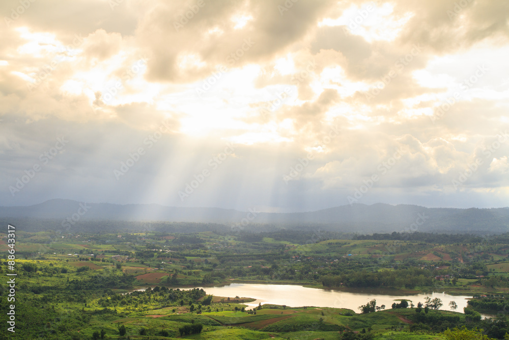 Sunray over lake and mountain in Khao Kho District, Thailand