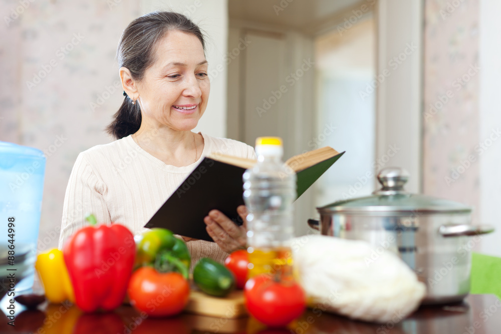  mature housewife reads cookbook