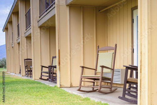 Backyard of American Motel Environment with Row of Chairs in Lin