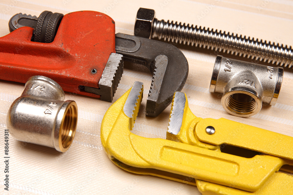 Fitting and two adjustable wrenches for plumbing works Fitting and two adjustable wrenches for plumbing works