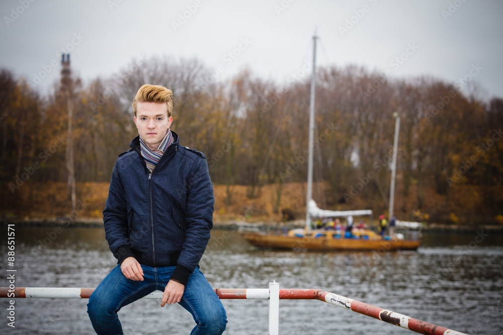 Fototapeta premium Young handsome man model casual style hair styling outdoor