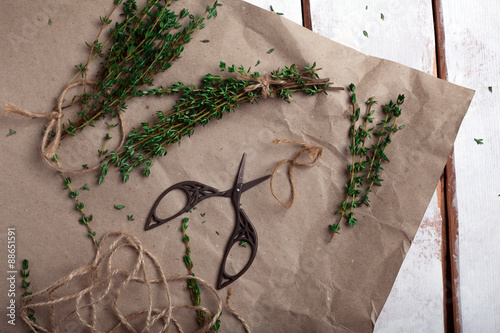 sprigs of thyme dismantled on a brown paper