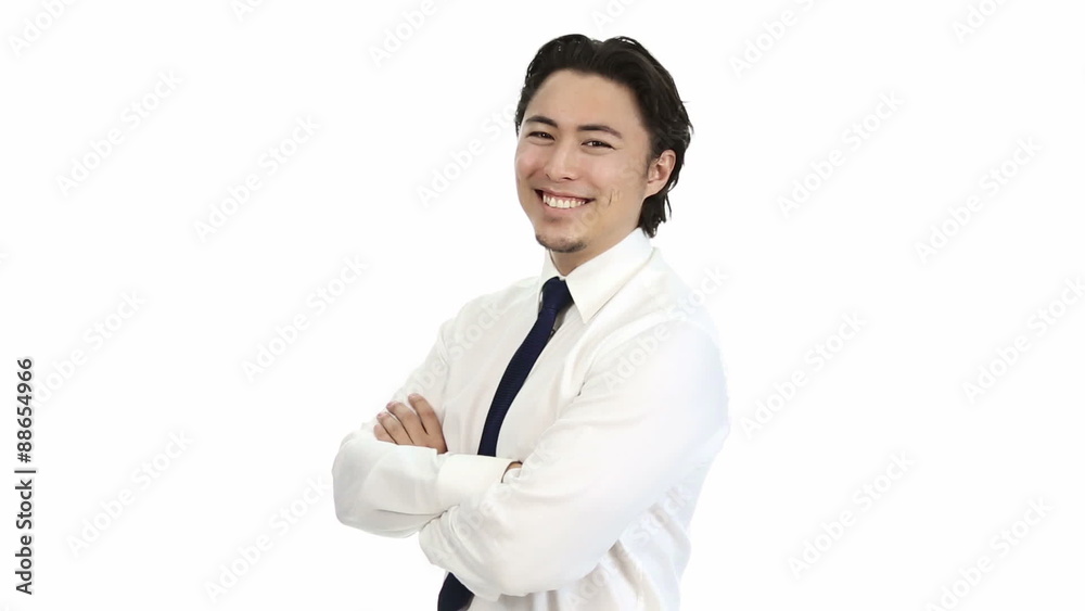 Attractive businessman in his 20s, wearing a white shirt and a blue tie. Feeling confident with his arms crossed. White background. Attractive businessman in his 20s, wearing a white shirt and a blue tie. Feeling confident with his arms crossed. White background.