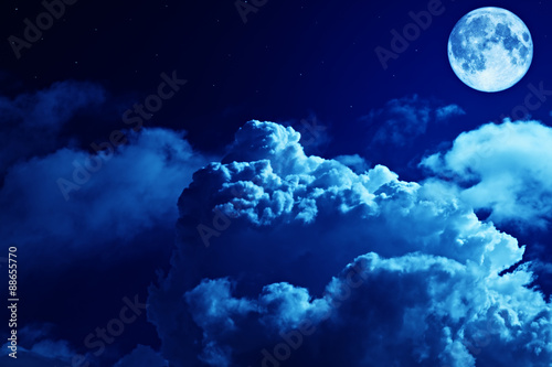 .Tragic night sky with a full moon and shining stars