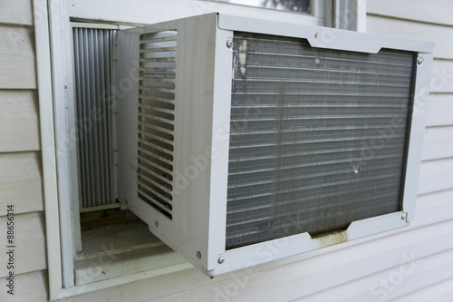 Window Air Conditioner Working To Keep Things Cool.