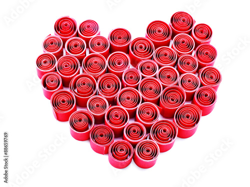 heart shape with red paper roll on white background