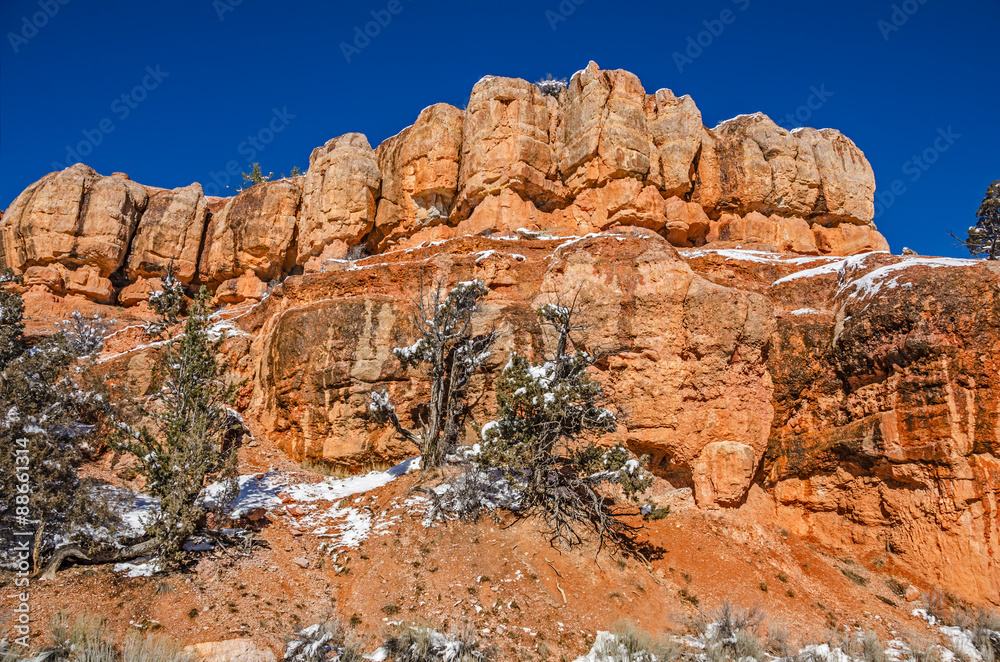 Orange Rock Formations Against Blue Sky