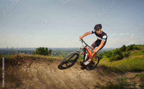 Fototapeta Naklejka Na Ścianę i Meble -  cyclist rides in the mountains