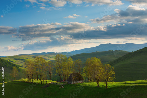 Shepard house on the top of the hill in the mountains photo