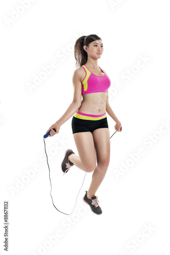 Woman with skipping rope © DragonImages