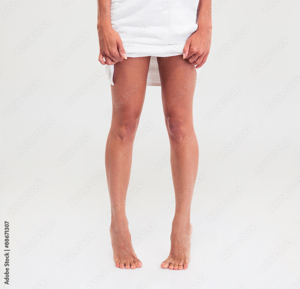 Closeup portrait of female legs with towel