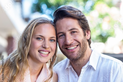 Smiling couple sitting closely together