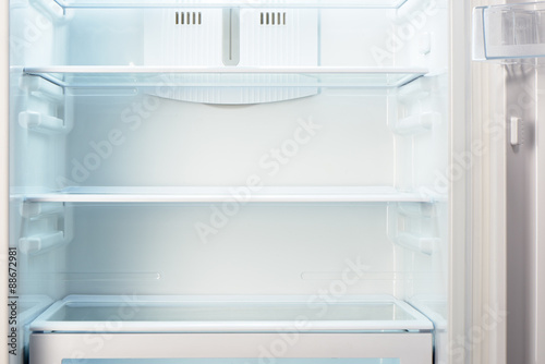 White open empty refrigerator. Weight loss diet concept.