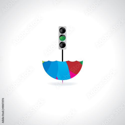 creative colorful umbrella with green traffic signal photo