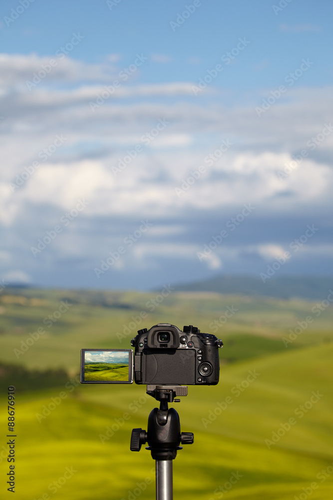 Dslr camera photographing Tuscany hills