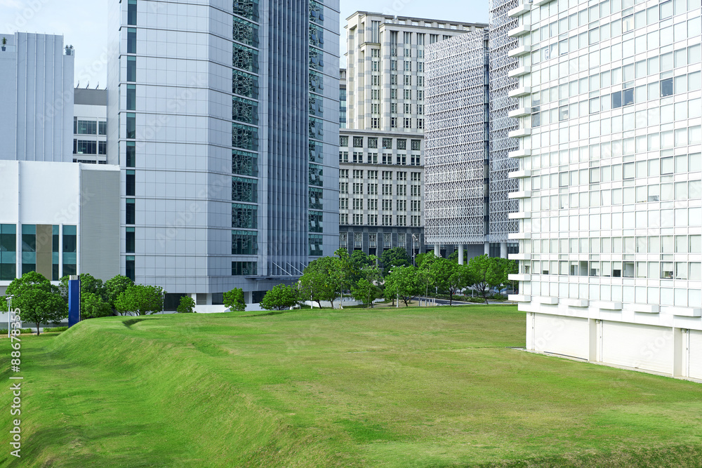 Green park in front of modern office exterior