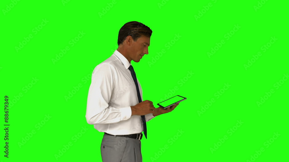 Businessman using his tablet pc Businessman using his tablet pc